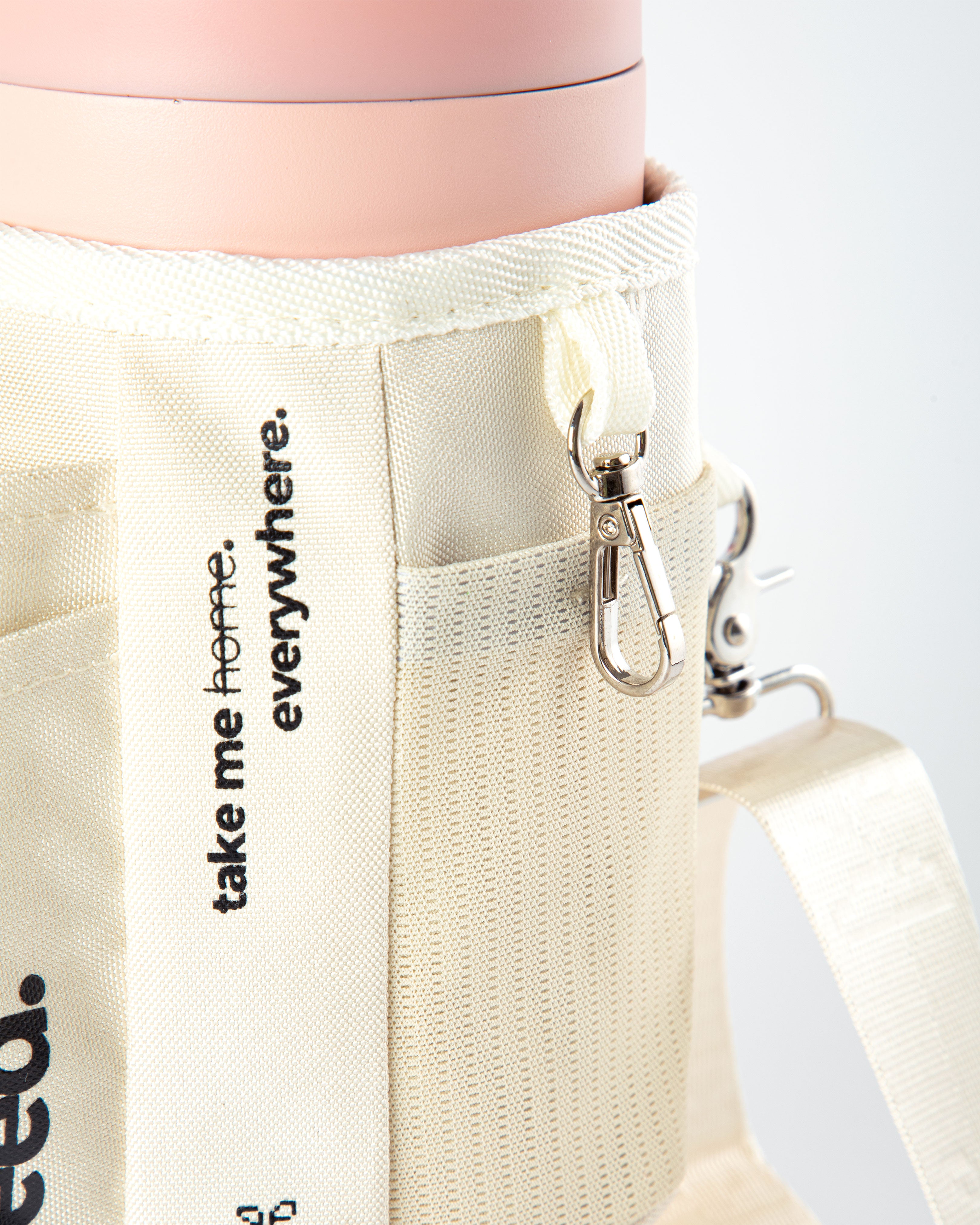Beige tote bag with 'take me home. everywhere.' text and a keychain on a white background 1.2l-stainless-steel-tumbler-baby-pink-carry-all-sleeve-white-side-mesh-pocket-and-keychain-holder baby pink & milkyway