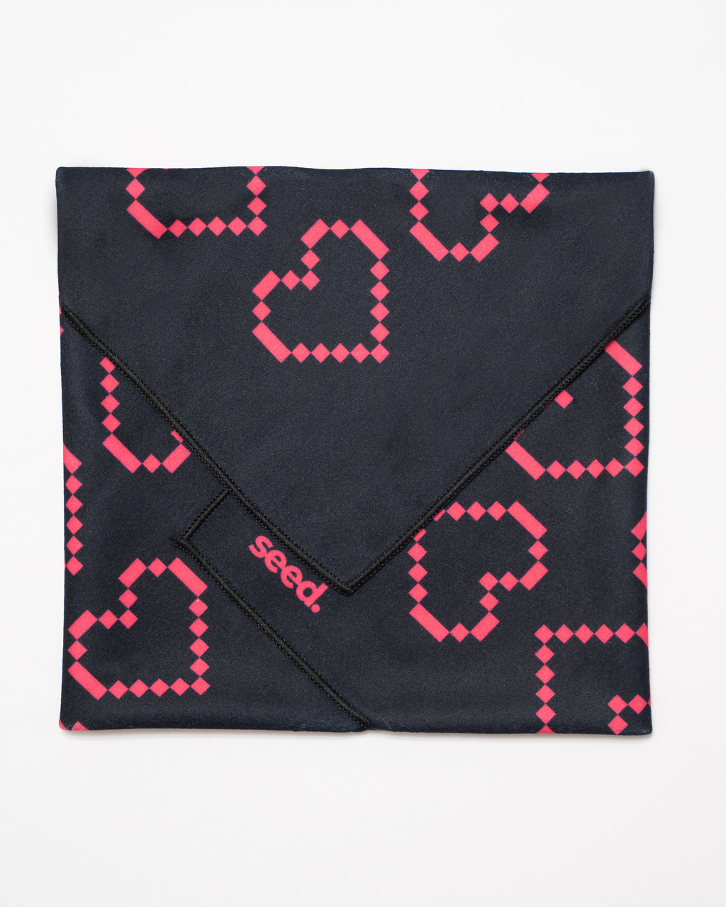 Black fabric with pink geometric pattern and 'seed' branding on a white background Hold Up Magic Self Adhesive Wrap Organiser Tell Tale Heart