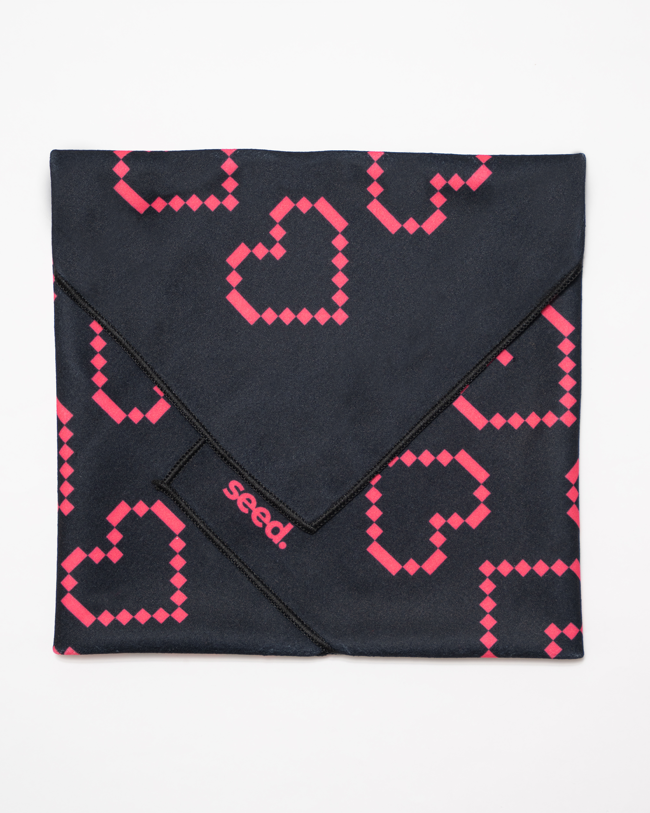 Black fabric with pink geometric pattern and 'seed' branding on a white background Hold Up Magic Self Adhesive Wrap Organiser Tell Tale Heart