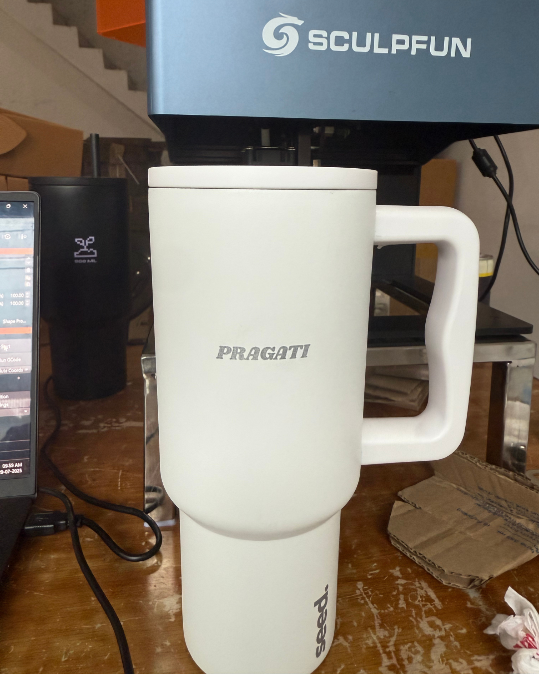White stainless steel bottle with 'Pragati' laser engraved on it stainless steel tumbler 900mL moonlight
