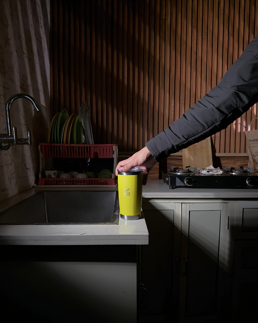 Person holding a yellow mug in a kitchen setting stainless steel tumbler 600mL lemonade  insulated stainless steel travel coffee mug 600mL 