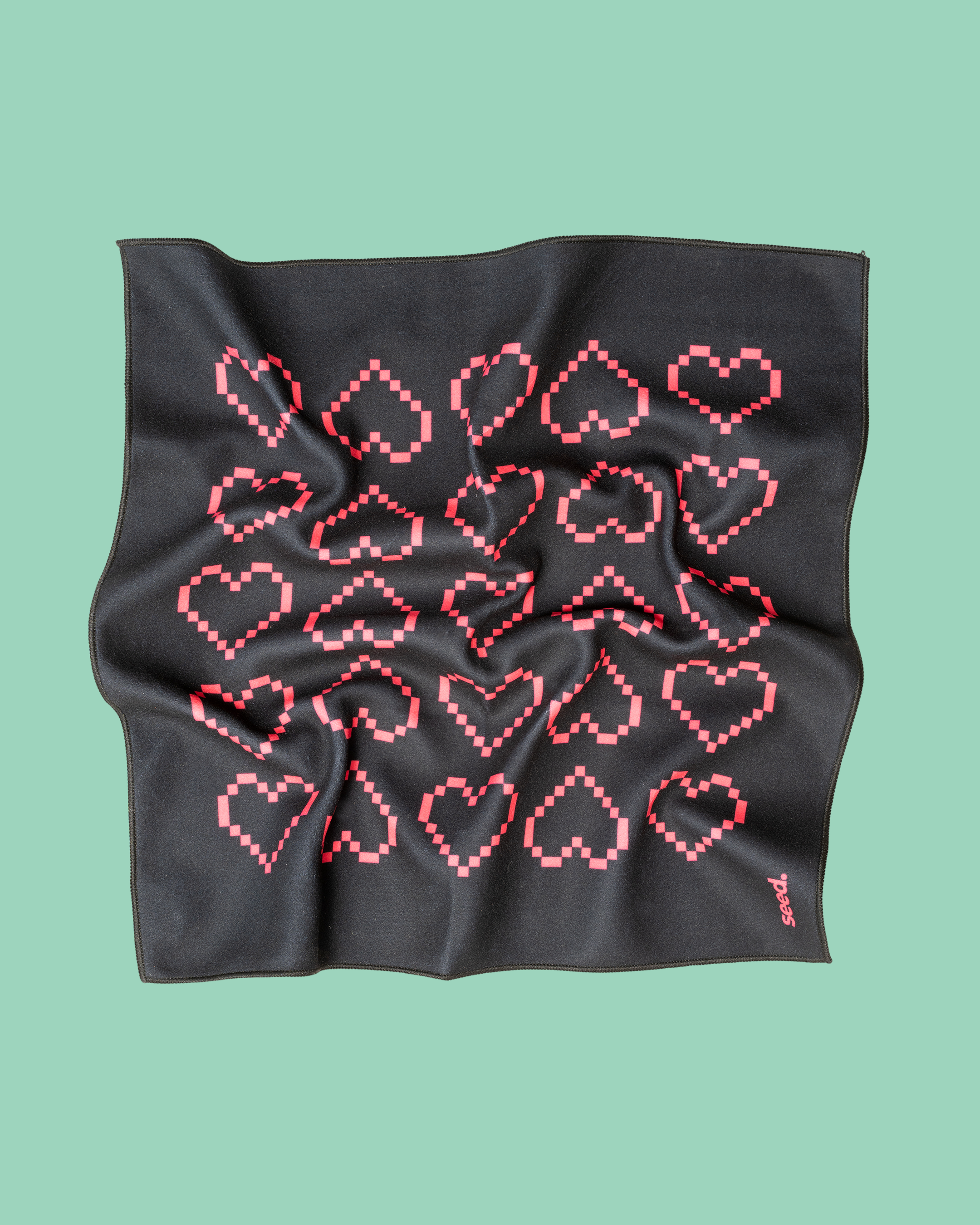 Black fabric with red heart pattern on a green background Hold Up Magic Self Adhesive Wrap Organiser Tell Tale Heart