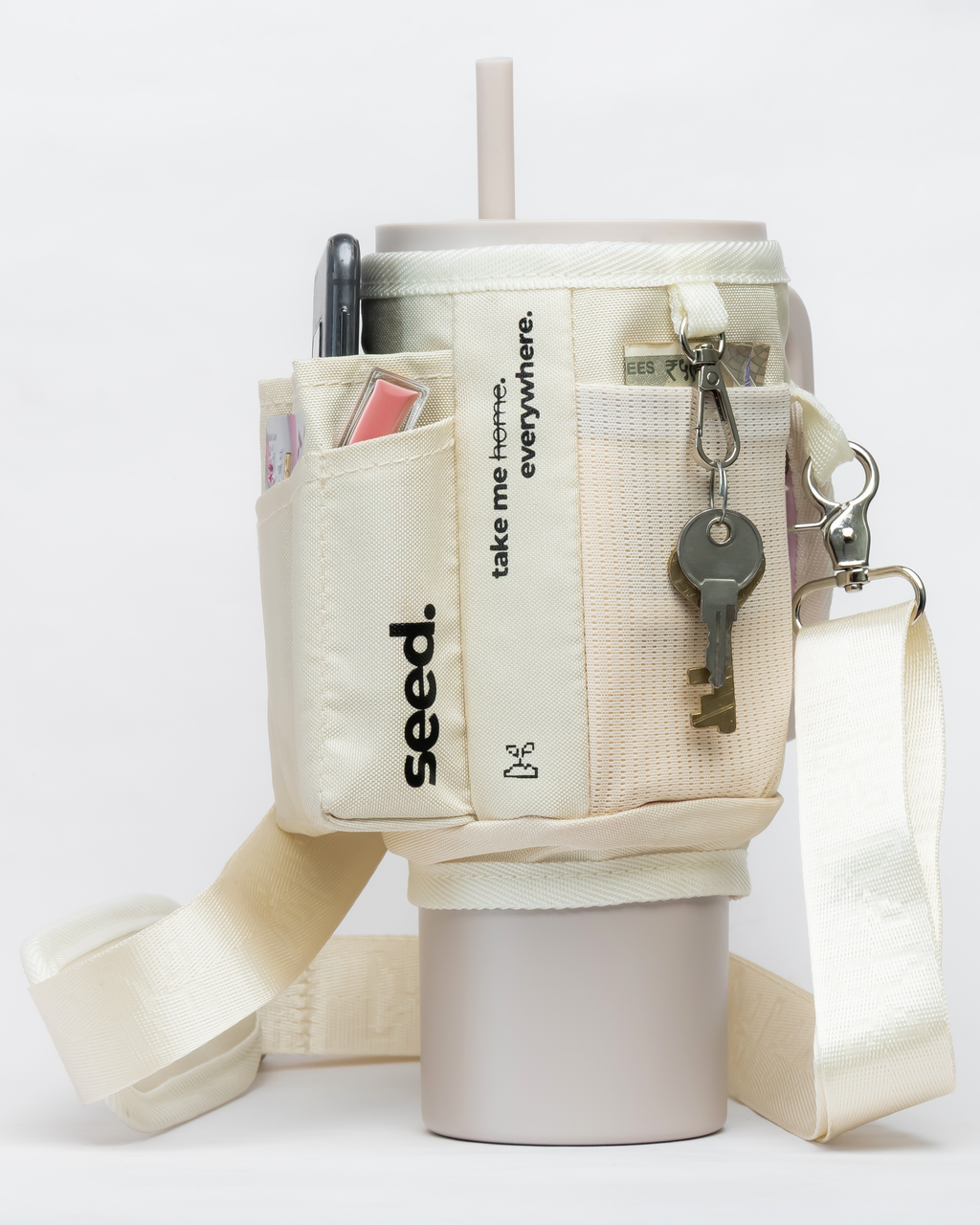 White insulated stainless steel tumbler water bottle with sleeve holder sling bag, straw, and keys on a white background milkyway & milk tea
